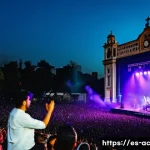 Home 19 현존 기반 공연 접근법의 시장 조사 방법 - A vibrant live concert scene in a large open-air venue in Mexico City at dusk, featuring a charismat...
